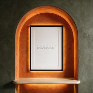 Framed typographic growth print within a backlit persimmon plaster arch.
