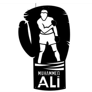 May include: Black and white silhouette of a boxer in a fighting stance inside a boxing glove. The glove is wrapped with tape and has the text "Muhammad Ali" on the bottom.