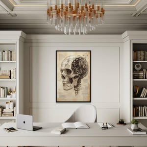 May include: An office setting featuring a framed anatomical skull print, a laptop, and an open book on a white desk. A modern chandelier hangs above. Bookshelves flank the desk, creating a workspace with a blend of art and functionality.