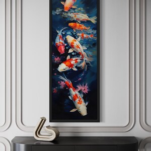 a large framed painting of colorful koi fish swimming in a pond, hanging on a wall above a black shelf.