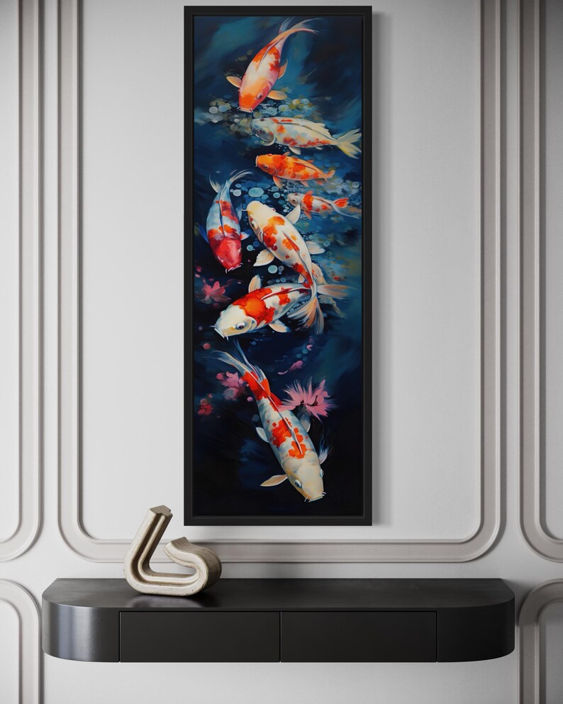 a large framed painting of colorful koi fish swimming in a pond, hanging on a wall above a black shelf.
