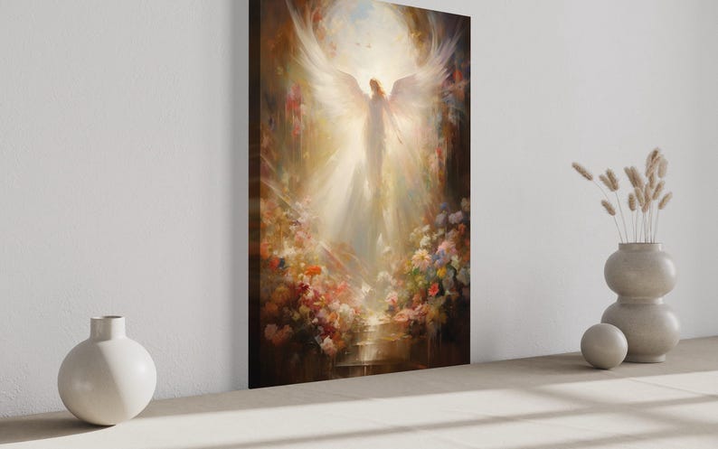 a large painting of an angel with outstretched wings, surrounded by a vibrant floral scene. The painting is displayed on a wall, with a white vase and a small white ball placed next to it.