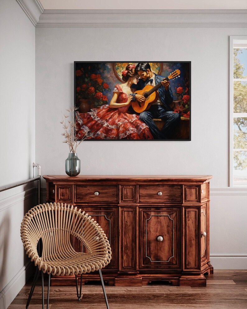a painting of a couple in a romantic embrace, with the man playing a guitar and the woman wearing a red dress. The painting is hung on a white wall above a wooden cabinet, which has a woven chair placed in front of it.