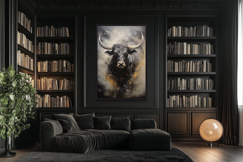 a large black bull painting on the wall of a room with a black sofa, bookshelves, and a potted plant.