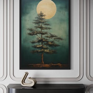 a large painting of a tree with a large yellow moon in the background, hanging on a wall above a black shelf.