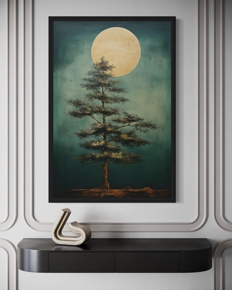 a large painting of a tree with a large yellow moon in the background, hanging on a wall above a black shelf.