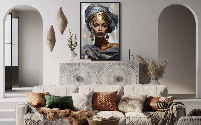a modern living room with a white sofa adorned with colorful throw pillows. Above the sofa, there is a framed painting of a woman with a headdress, adding an artistic touch to the room. The room also includes a white archway, a potted plant, and a vase, contributing to the overall aesthetic.