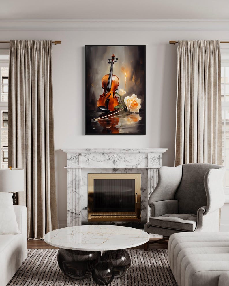 a living room with a white fireplace, a framed painting of a violin and roses hanging on the wall above it, and a marble fireplace surround. The room is furnished with a gray armchair, a white sofa, and a round coffee table.