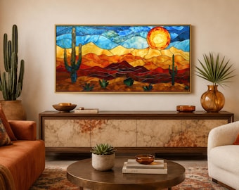 May include: A rectangular wall art piece featuring a stained glass style desert landscape. The scene depicts a bright orange sun over layered hills in shades of red, orange, and yellow, with tall green saguaro cacti under a blue sky.