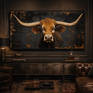 May include: A large rectangular wall art piece featuring a detailed portrait of a brown longhorn steer with expansive horns against a dark, textured background with gold accents, displayed in a dimly lit room with dark wood furniture.