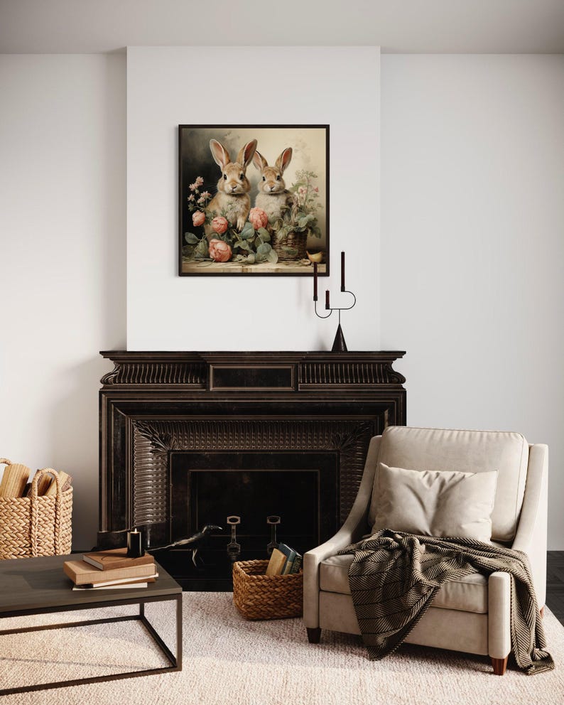 a cozy living room with a fireplace, a beige armchair, and a wooden coffee table. A framed painting of two rabbits is hanging on the wall above the fireplace.