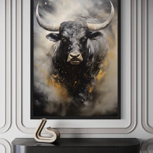 a large black bull with prominent horns, which is the central focus of the artwork displayed on the wall.