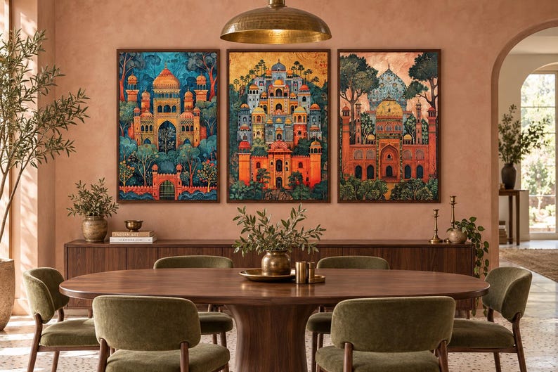 May include: A set of three framed vertical wall art prints depicting intricate architectural structures with domes and arches in vibrant shades of orange, blue, and gold, surrounded by stylised trees and foliage, displayed above a wooden sideboard.