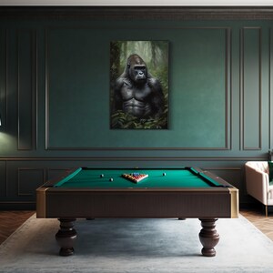 a pool table with a large portrait of a gorilla hanging on the wall above it.