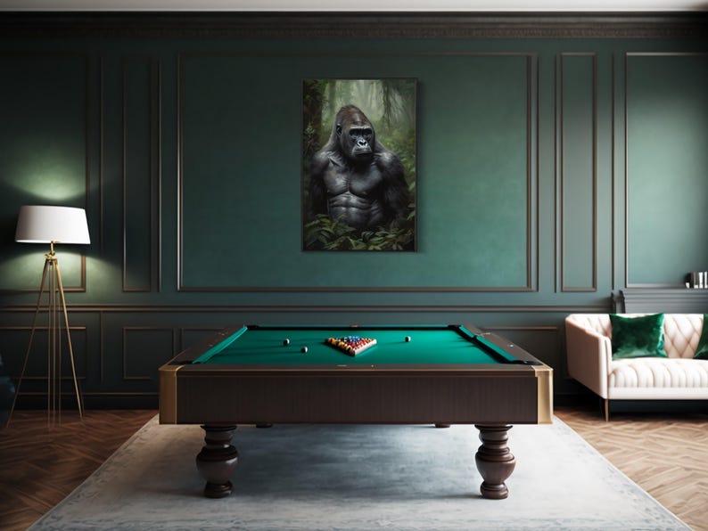 a pool table with a large portrait of a gorilla hanging on the wall above it.