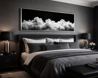 May include: A modern bedroom with a dark gray color scheme. A large framed artwork depicting white clouds against a black background hangs above a bed with gray bedding and pillows. Black lamps and a bench complete the room's elegant design.