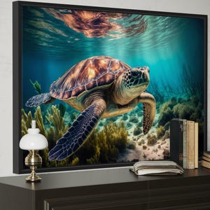 A framed photograph of a sea turtle swimming in the ocean, with a coral reef and other marine life visible in the background.