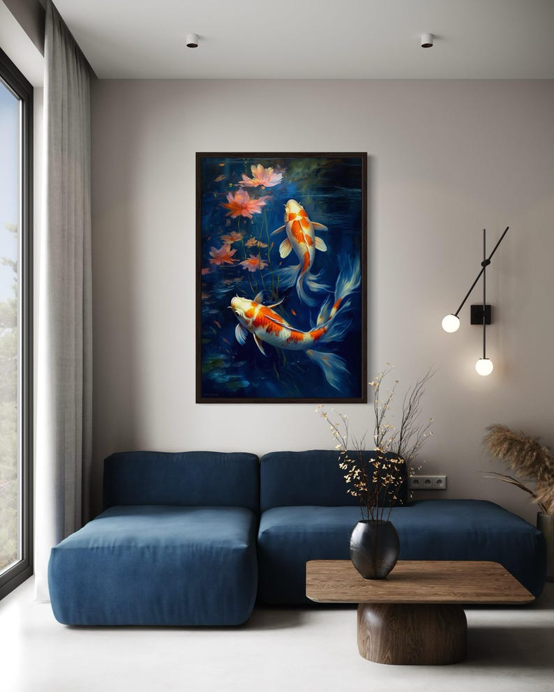 a living room with a blue sofa, a wooden coffee table, and a framed painting of two koi fish swimming in a pond with flowers.