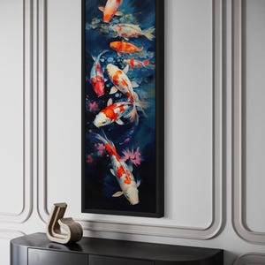a large framed painting of colorful koi fish swimming in a pond, hanging on a wall above a black shelf.