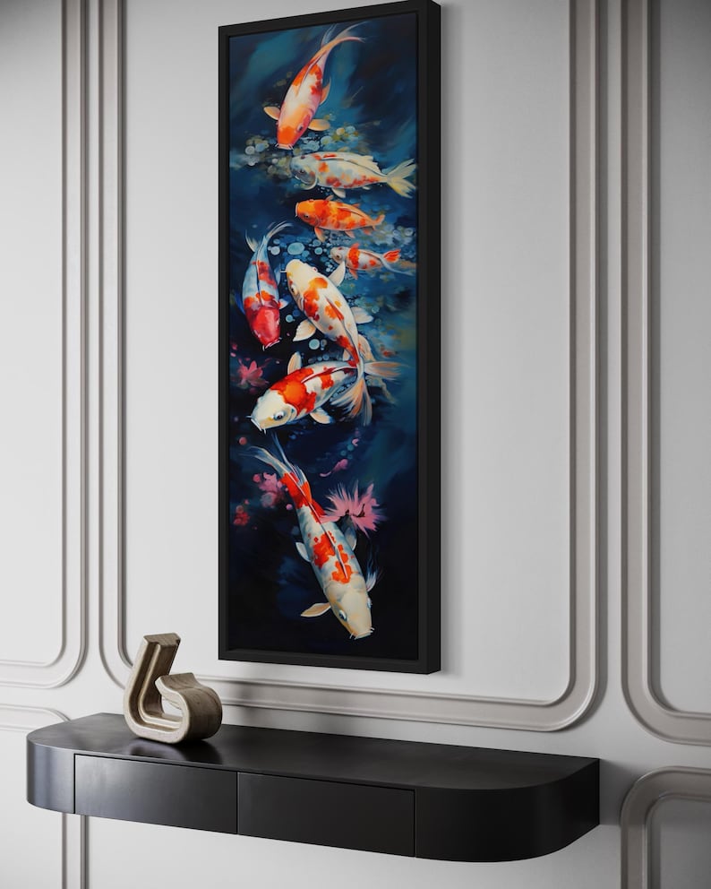 a large framed painting of colorful koi fish swimming in a pond, hanging on a wall above a black shelf.