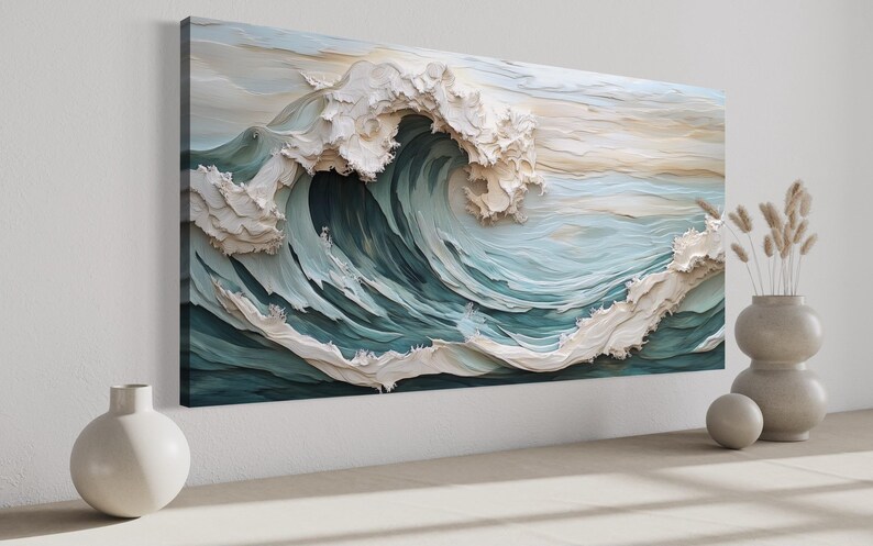 a large, intricately designed wave painting hanging on a wall, with a vase of dried flowers placed next to it.