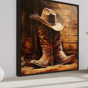 a large painting of a pair of cowboy boots and a cowboy hat, set against a rustic wooden background.