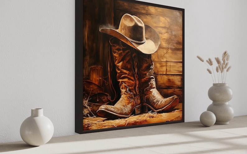 a large painting of a pair of cowboy boots and a cowboy hat, set against a rustic wooden background.