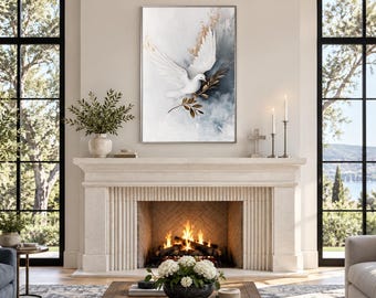 May include: A rectangular wall art print featuring a white dove in flight, accented with gold-toned leaf details against a soft gray and white watercolor background. The artwork is displayed in a thin silver frame above a stone fireplace mantel.