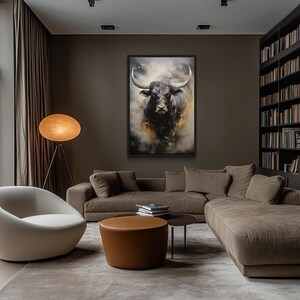 a modern living room with a large window overlooking trees, a white sofa, a round coffee table, and a large painting of a bull on the wall.