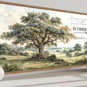 May include: A framed landscape print depicting a large tree in a field, with the text "IN CHRIST GOD FORGAVE YOU" and "Ephesians 4:32". The artwork has a natural theme, with a wooden frame and a neutral colour palette.