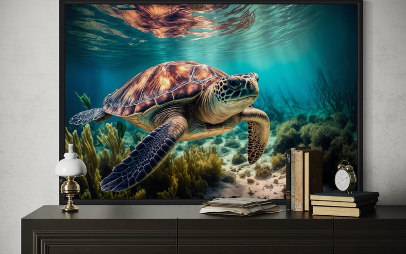 a large framed picture of a sea turtle swimming in the ocean, with a coral reef and underwater plants visible in the background.