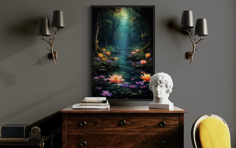 a wooden dresser with a bust of a person on top, a stack of books, and a painting of a forest with a stream and colorful flowers. The dresser is situated in a room with a gray wall, and there are two wall sconces above it.