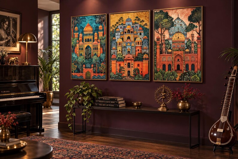 May include: Three rectangular framed wall art prints featuring vibrant, detailed illustrations of ornate palaces with domes, arches, and lush greenery. The artwork displays a rich colour palette of deep oranges, blues, and greens, presented in thin gold frames.