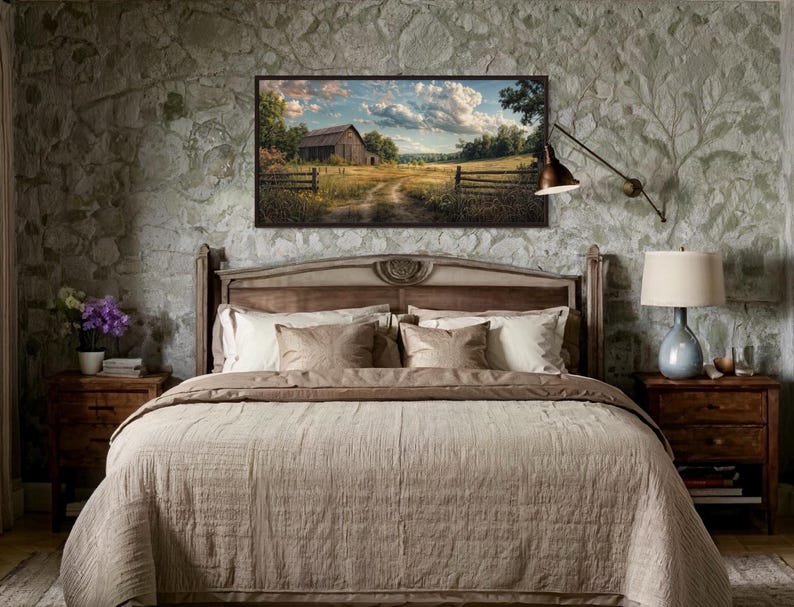 a serene bedroom scene with a large bed, wooden nightstands, and a painting of a rural landscape hanging above it.