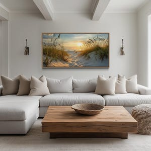 a modern living room with a large window overlooking a beach, a wooden coffee table, and a comfortable sectional sofa with throw pillows.
