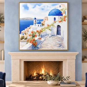 May include: A square framed wall art print depicting a Mediterranean coastal scene with white buildings, bright blue domes, and vibrant orange flowers cascading over a stone wall, overlooking a deep blue sea under a clear sky.