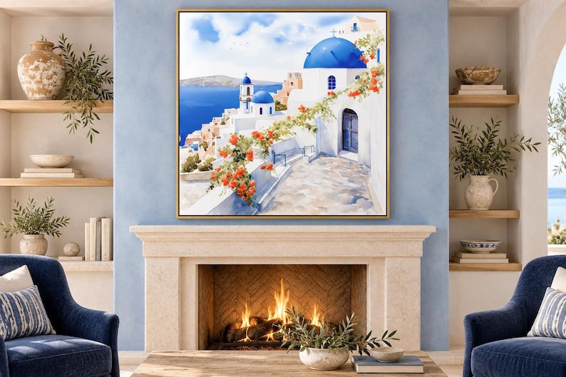 May include: A square framed wall art print depicting a Mediterranean coastal scene with white buildings, bright blue domes, and vibrant orange flowers cascading over a stone wall, overlooking a deep blue sea under a clear sky.