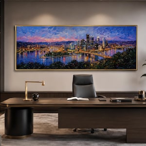 May include: A large rectangular oil painting in a gold frame depicting a city skyline at twilight. The scene features illuminated skyscrapers, bridges, and a river reflecting vibrant blue, orange, and yellow lights under a sunset sky.
