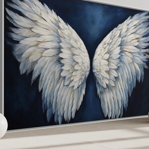 a large painting of white feathers on a dark background, with two white vases and a potted plant placed in front of it.