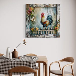 a dining room with a wooden table and chairs, a vase with flowers, and a framed painting of a rooster on the wall.