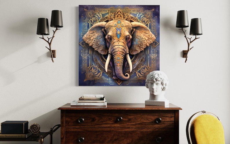 a large, ornate elephant head on a blue and gold background, mounted on a wall above a wooden dresser. The dresser has a white bust and a stack of books on top. The room also includes a yellow chair and two black lamps on either side of the wall.