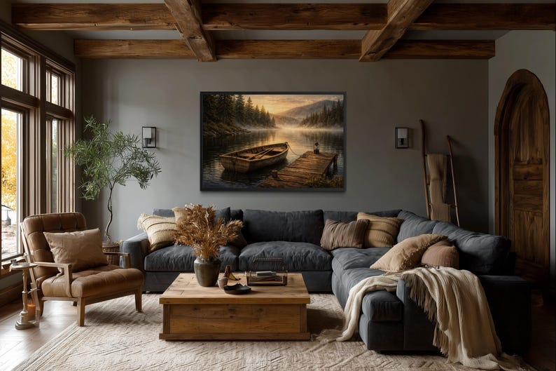 May include: A cozy living room with a large sectional sofa, wooden coffee table, and a framed landscape painting of a boat on a lake. The room features a warm color palette with wooden beams and a comfortable armchair.