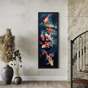 a large framed painting of colorful koi fish swimming in a pond, hanging on a wall in a room with a wooden floor and a metal railing.