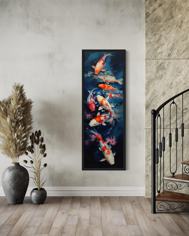 a large framed painting of colorful koi fish swimming in a pond, hanging on a wall in a room with a wooden floor and a metal railing.