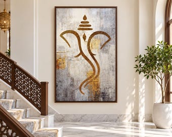 May include: A rectangular wall art piece featuring a stylized gold Ganesha silhouette centered on a textured background of gray, white, and metallic gold tones. The artwork is framed in a dark brown wood border and hangs on a neutral wall.
