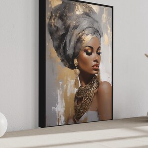a large framed painting of a woman with a headdress, placed on a wall next to two white vases and a small white sculpture.