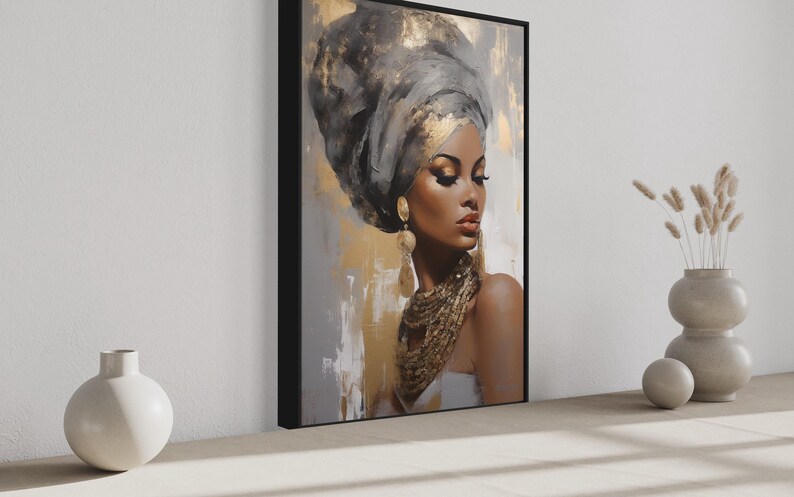 a large framed painting of a woman with a headdress, placed on a wall next to two white vases and a small white sculpture.