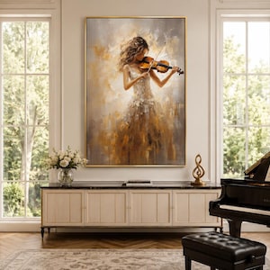 May include: A large rectangular wall art piece featuring an impressionistic oil painting of a person playing a violin. The figure wears a textured white dress against a warm, abstract background of gold, beige, and brown brushstrokes.