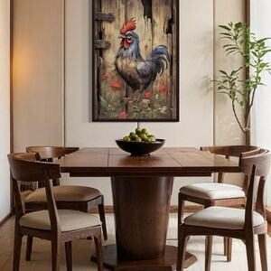 a wooden dining table with a bowl of fruit on it, surrounded by wooden chairs. Above the table, there is a framed painting of a rooster on a wooden door.
