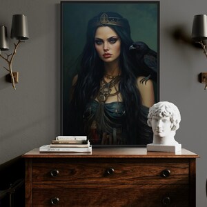 a large portrait of a woman with long dark hair and a crown, displayed on a wooden dresser. The dresser also has a statue of a man's head and a stack of books on top. The room has a gray wall, a lamp, and a chair.